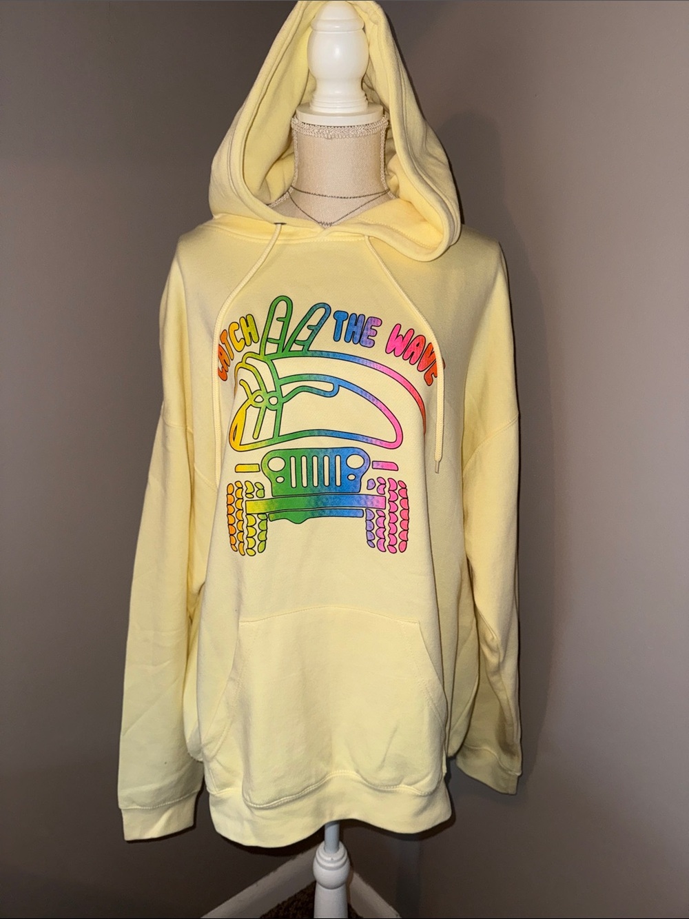 Pacifica Pale Yellow Hoodie with Rainbow Jeep Graphic.